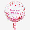 A Personalised Heart Bubble Balloon from the Customisable collection from Box Balloons saying 'I love you, Michelle'.